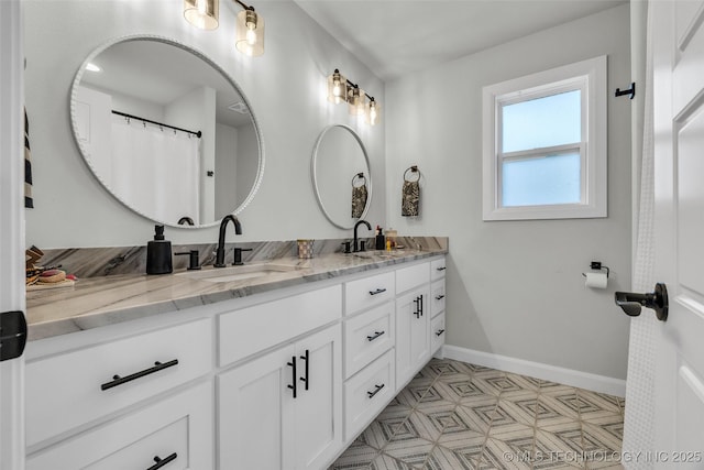 25133 Shade Tree Pl, Claremore, OK 74019 - full bathroom with double vanity and baseboards