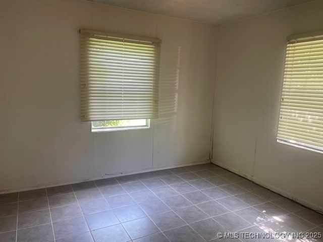 720 B NE, Ardmore, OK 73401 - empty room featuring tile patterned flooring and baseboards