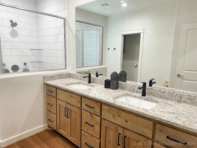 775 E Finley Ridge Dr, Tahlequah, OK 74464 - full bath with double vanity, wood finished floors, and a tile shower