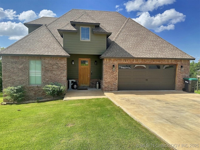 775 E Finley Ridge Dr, Tahlequah, OK 74464 - view of front of house with brick siding, a garage, driveway, and a front yard