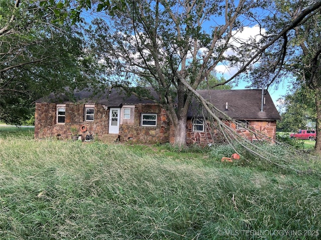 13226 N 91st Ave E, Collinsville, OK 74021 - view of front facade with stone siding and a shingled roof