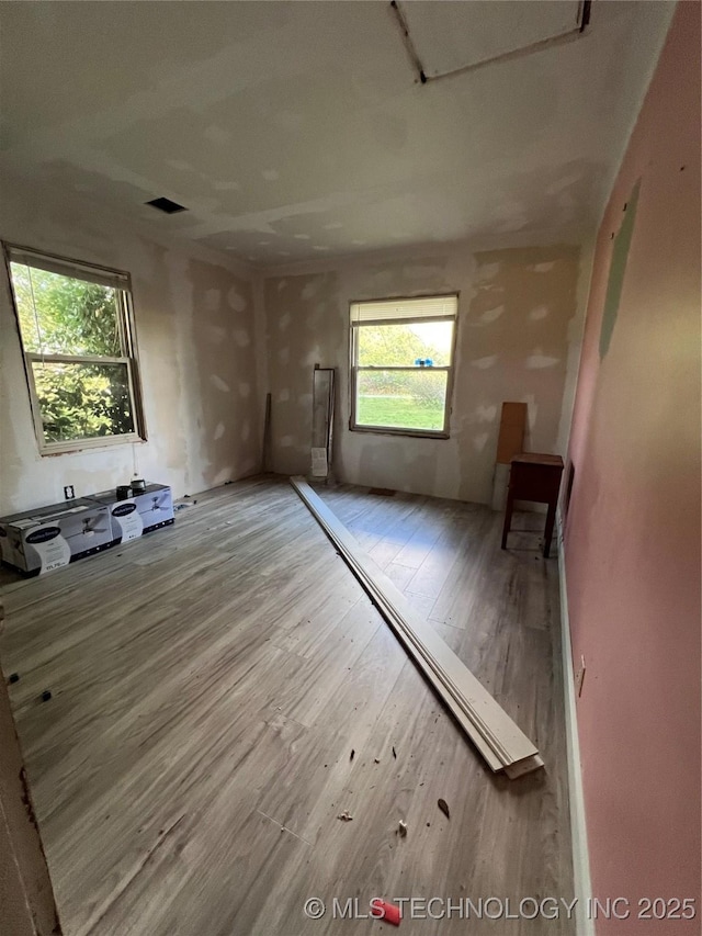 13226 N 91st Ave E, Collinsville, OK 74021 - unfurnished room with wood finished floors and healthy amount of natural light