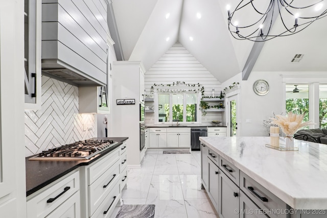 7604 S 6th St, Broken Arrow, OK 74011 - kitchen featuring appliances with stainless steel finishes, light marble finish flooring, vaulted ceiling, dark stone counters, and decorative backsplash