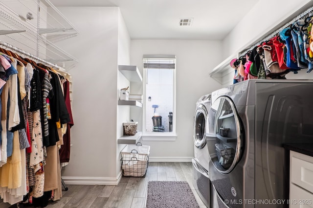 7604 S 6th St, Broken Arrow, OK 74011 - laundry area featuring washing machine and clothes dryer and wood finished floors