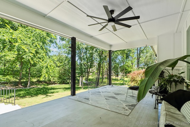 7604 S 6th St, Broken Arrow, OK 74011 - sunroom / solarium with ceiling fan and view of wooded area