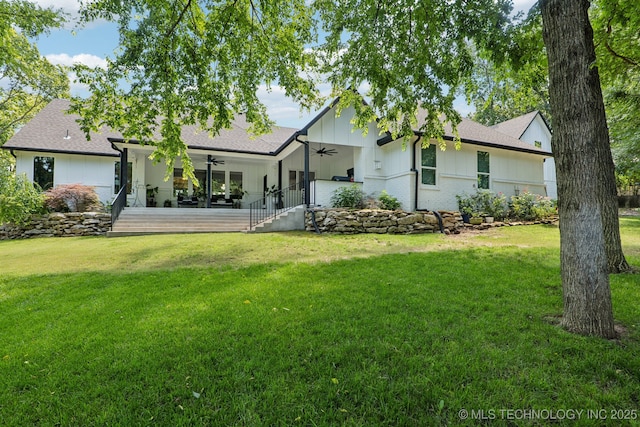 7604 S 6th St, Broken Arrow, OK 74011 - back of house with a ceiling fan, a lawn, board and batten siding, and a shingled roof