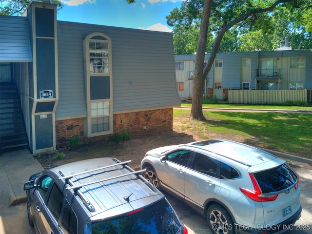 4654 E 68th St S Unit 199, Tulsa, OK 74136 - view of building exterior featuring uncovered parking
