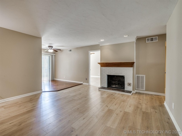 4654 E 68th St S Unit 199, Tulsa, OK 74136 - unfurnished living room with ceiling fan, a brick fireplace, light wood finished floors, and recessed lighting