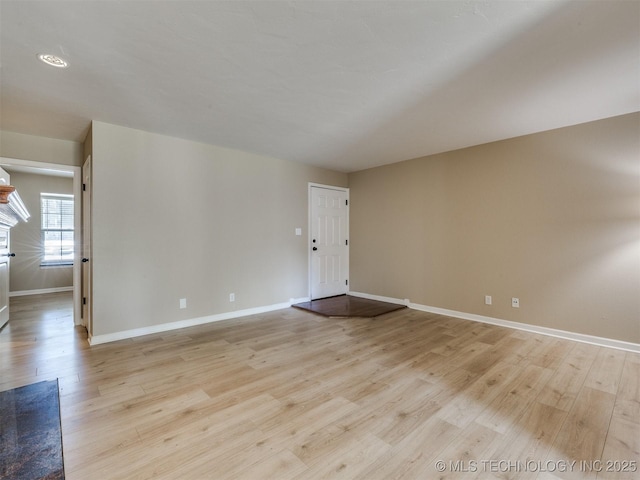 4654 E 68th St S Unit 199, Tulsa, OK 74136 - empty room featuring light wood-style floors and baseboards