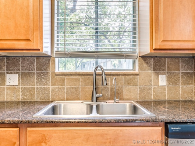 4654 E 68th St S Unit 199, Tulsa, OK 74136 - kitchen view of dishwasher, dark countertops, decorative backsplash, and light brown cabinets
