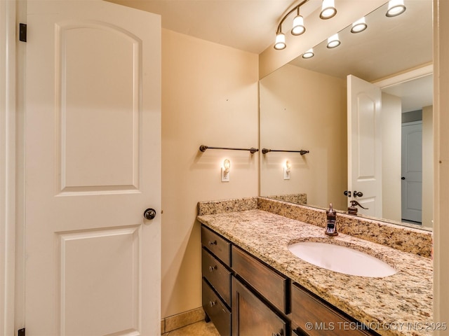 4654 E 68th St S Unit 199, Tulsa, OK 74136 - bathroom with vanity and baseboards