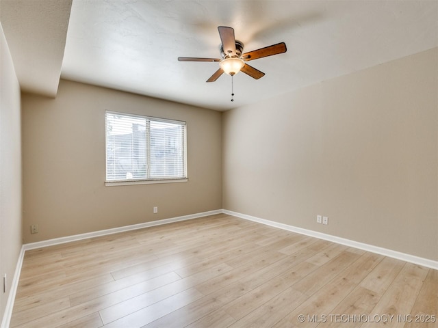 4654 E 68th St S Unit 199, Tulsa, OK 74136 - empty room with a ceiling fan and light wood-style flooring