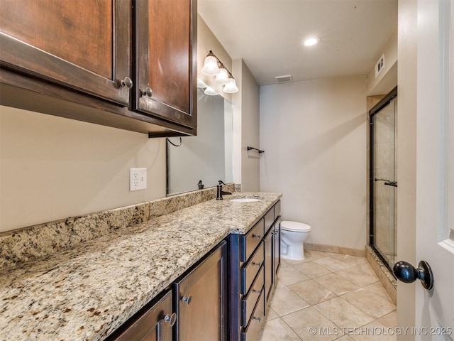 4654 E 68th St S Unit 199, Tulsa, OK 74136 - bathroom with vanity, tile patterned flooring, an enclosed shower, and recessed lighting