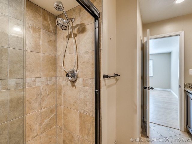 4654 E 68th St S Unit 199, Tulsa, OK 74136 - bathroom with a shower stall and wood finished floors