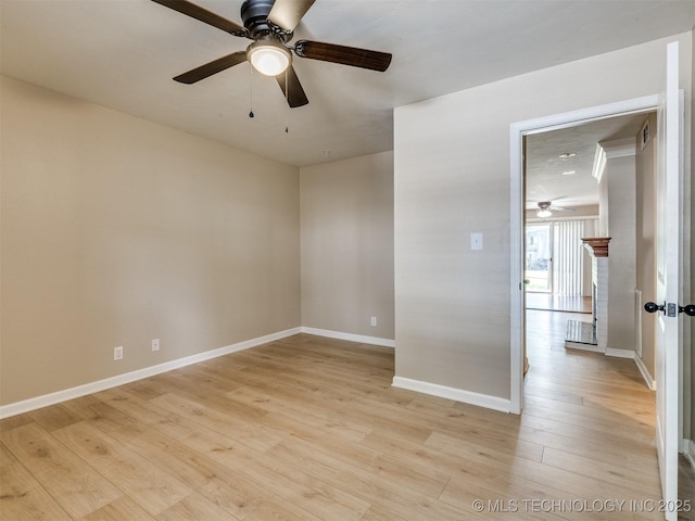 4654 E 68th St S Unit 199, Tulsa, OK 74136 - empty room featuring a ceiling fan and light wood-style flooring