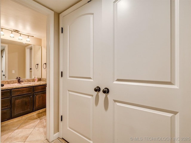 4654 E 68th St S Unit 199, Tulsa, OK 74136 - bathroom with vanity, tile patterned floors, and track lighting
