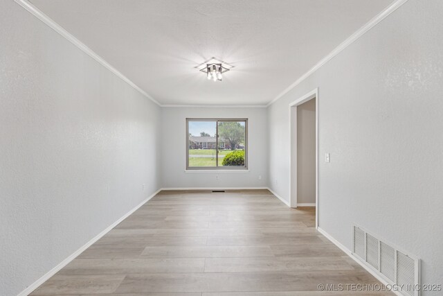 10936 N 108th E Ave, Owasso, OK 74055 - unfurnished room featuring ornamental molding and light wood-style floors