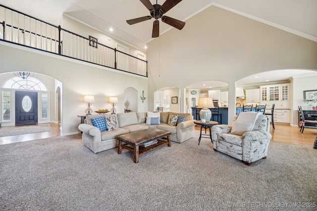 13614 W 42nd Pl, Sand Springs, OK 74063 - living room with high vaulted ceiling, arched walkways, ceiling fan, and crown molding