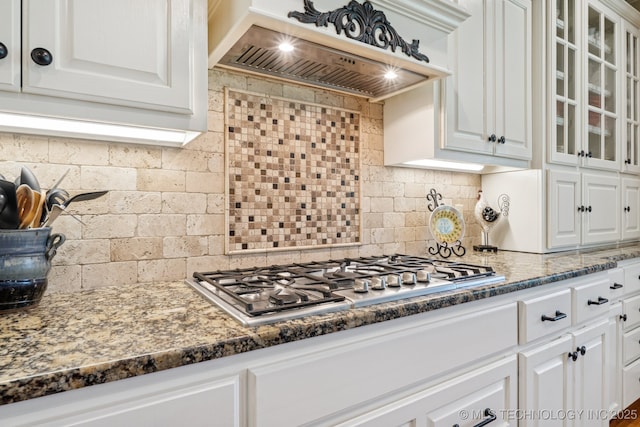 13614 W 42nd Pl, Sand Springs, OK 74063 - kitchen featuring premium range hood, stainless steel gas stovetop, white cabinets, and glass insert cabinets