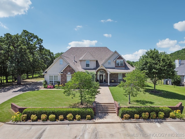 13614 W 42nd Pl, Sand Springs, OK 74063 - view of front facade with a front yard and brick siding