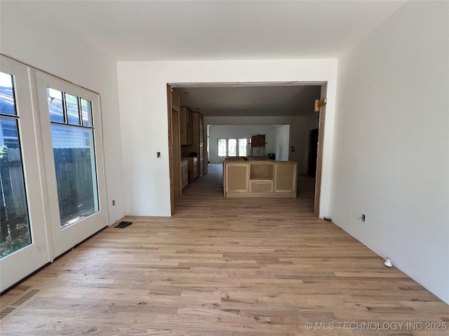 4949 S Boston Pl, Tulsa, OK 74105 - unfurnished living room featuring light wood finished floors