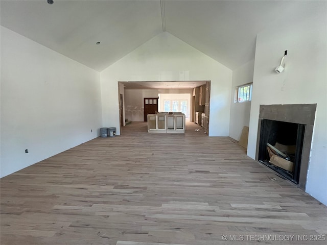4949 S Boston Pl, Tulsa, OK 74105 - unfurnished living room with high vaulted ceiling, light wood finished floors, and a fireplace