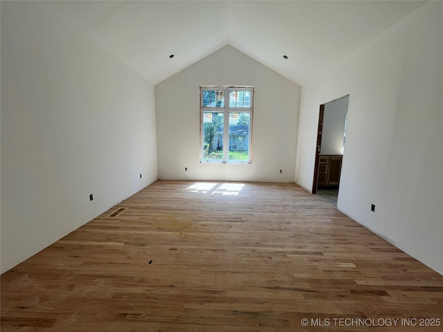 4949 S Boston Pl, Tulsa, OK 74105 - additional living space featuring vaulted ceiling and light wood-style flooring