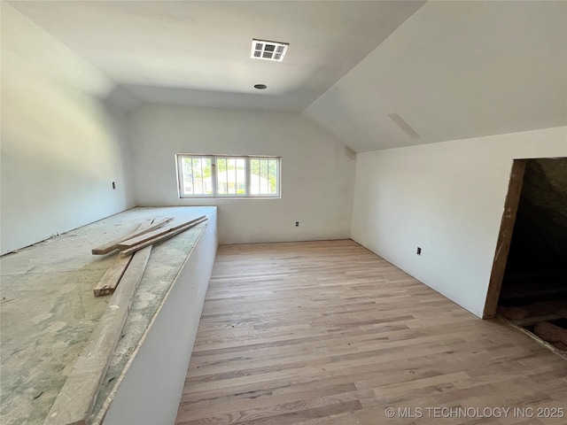 4949 S Boston Pl, Tulsa, OK 74105 - additional living space with wood finished floors and vaulted ceiling
