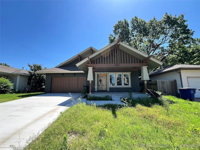 4949 S Boston Pl, Tulsa, OK 74105 - craftsman-style home with concrete driveway and an attached garage