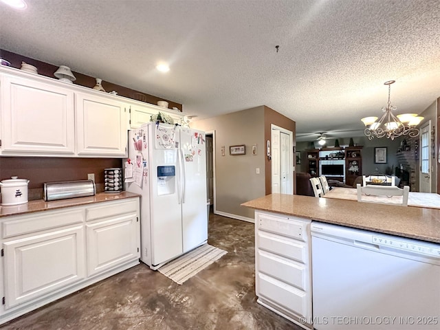 7515 S 108th E Ave, Tulsa, OK 74133 - kitchen with white appliances, a textured ceiling, a chandelier, white cabinets, and a ceiling fan