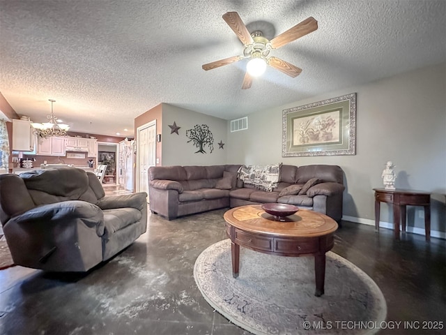 7515 S 108th E Ave, Tulsa, OK 74133 - living area featuring concrete flooring, a ceiling fan, a textured ceiling, and a chandelier