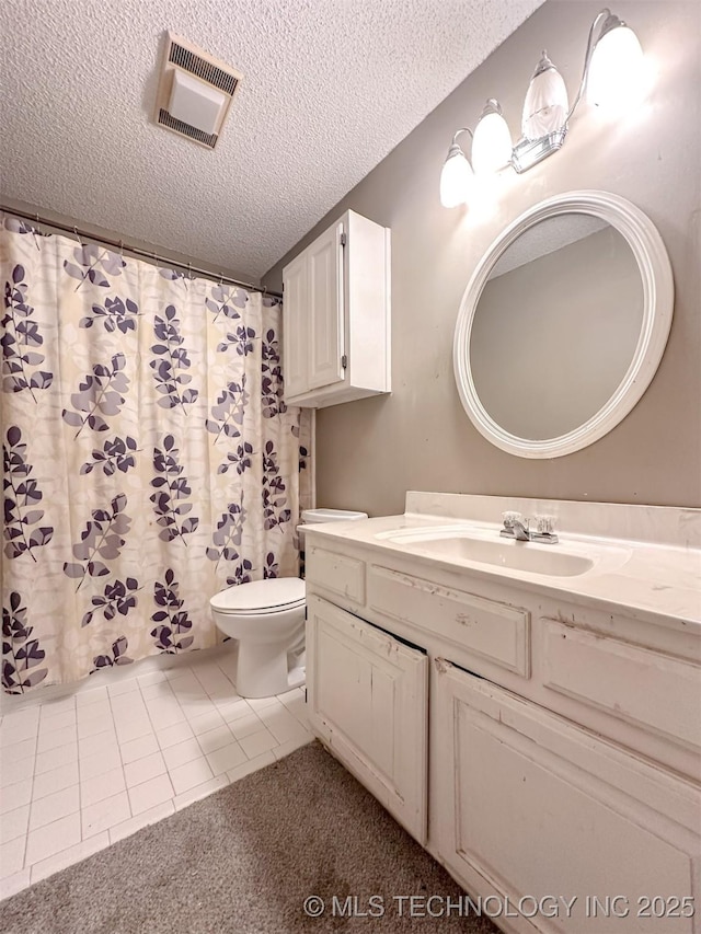 7515 S 108th E Ave, Tulsa, OK 74133 - full bathroom with vanity, tile patterned flooring, a textured ceiling, and a shower with shower curtain
