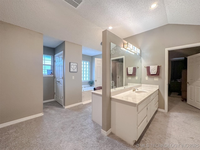 7515 S 108th E Ave, Tulsa, OK 74133 - full bathroom featuring vanity, lofted ceiling, a garden tub, carpet floors, and a textured ceiling