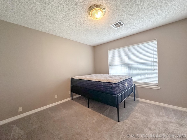 7515 S 108th E Ave, Tulsa, OK 74133 - bedroom with carpet floors and a textured ceiling