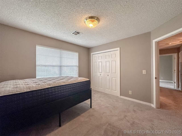 7515 S 108th E Ave, Tulsa, OK 74133 - bedroom with light carpet and a closet