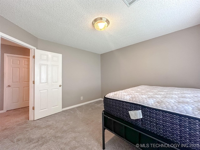 7515 S 108th E Ave, Tulsa, OK 74133 - carpeted bedroom featuring baseboards and a textured ceiling