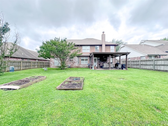 7515 S 108th E Ave, Tulsa, OK 74133 - rear view of property with a vegetable garden, a patio area, a chimney, and a fenced backyard