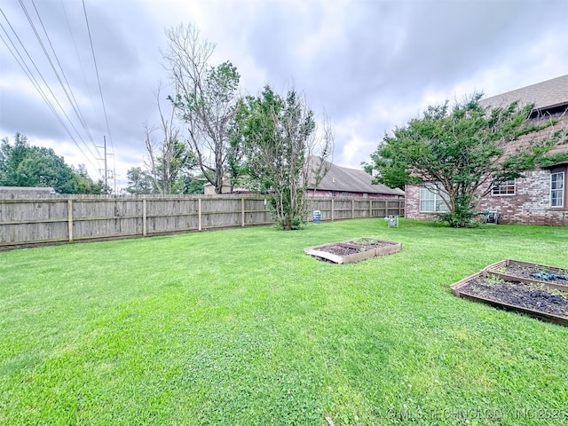 7515 S 108th E Ave, Tulsa, OK 74133 - fenced backyard featuring a garden