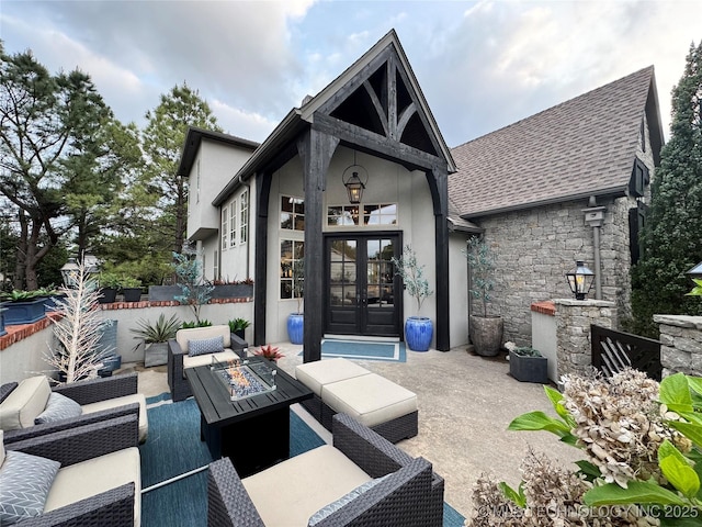 2920 E 27th Pl, Tulsa, OK 74114 - view of patio featuring french doors and an outdoor living space with a fire pit