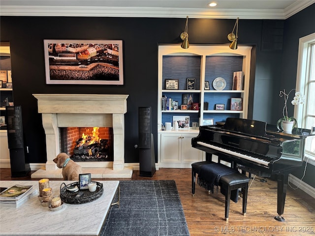 2920 E 27th Pl, Tulsa, OK 74114 - sitting room with a lit fireplace, dark wood-style flooring, crown molding, and healthy amount of natural light