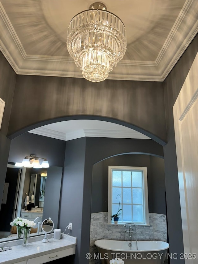 2920 E 27th Pl, Tulsa, OK 74114 - full bath with a soaking tub, ornamental molding, a chandelier, and vanity