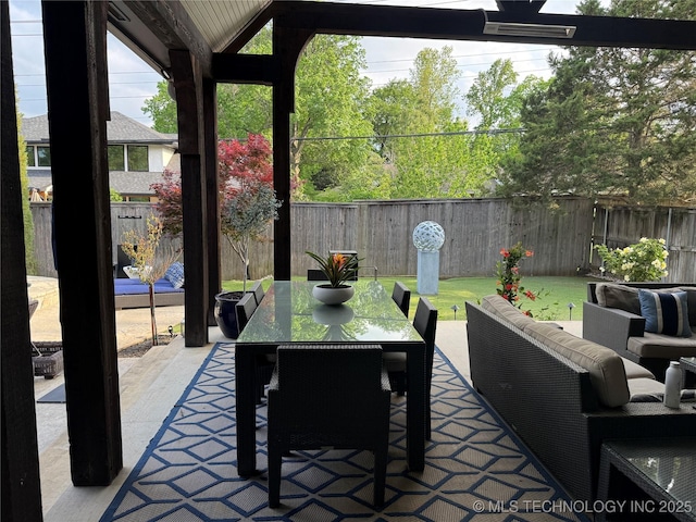 2920 E 27th Pl, Tulsa, OK 74114 - fenced backyard with a patio area, outdoor lounge area, and outdoor dining area