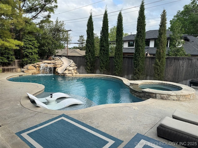 2920 E 27th Pl, Tulsa, OK 74114 - view of pool with a water slide, a fenced backyard, a pool with connected hot tub, and a patio area