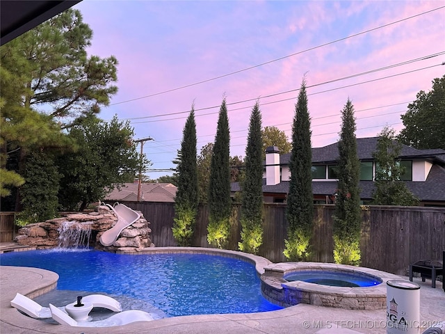 2920 E 27th Pl, Tulsa, OK 74114 - view of pool with a water slide and a pool with connected hot tub