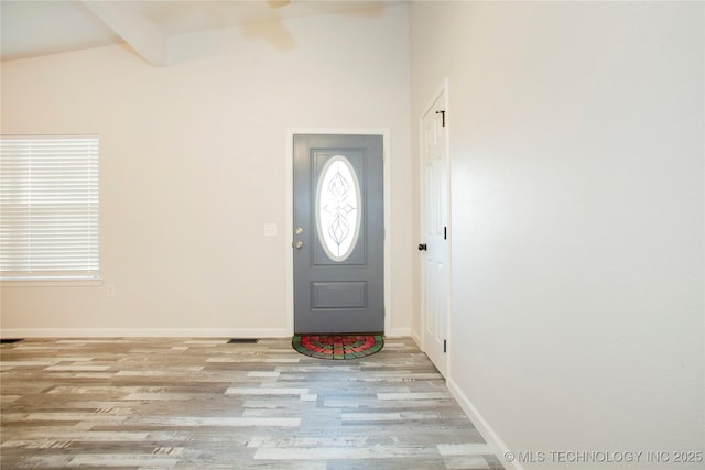 416434 Lakeside, Checotah, OK 74426 - foyer featuring wood finished floors, beamed ceiling, and ceiling fan