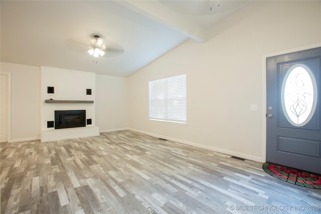 416434 Lakeside, Checotah, OK 74426 - foyer featuring ceiling fan, light wood-style floors, and a fireplace with raised hearth