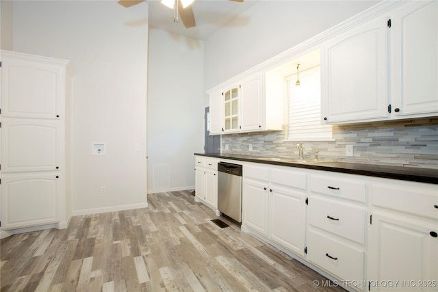 416434 Lakeside, Checotah, OK 74426 - kitchen featuring dishwasher, ceiling fan, dark countertops, and decorative backsplash