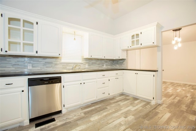 416434 Lakeside, Checotah, OK 74426 - kitchen featuring dishwasher, dark countertops, backsplash, glass insert cabinets, and light wood-type flooring