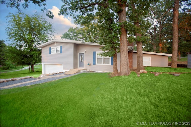 416434 Lakeside, Checotah, OK 74426 - tri-level home featuring a garage, a front lawn, and gravel driveway