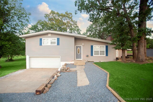416434 Lakeside, Checotah, OK 74426 - split level home featuring a front lawn, an attached garage, driveway, and a chimney